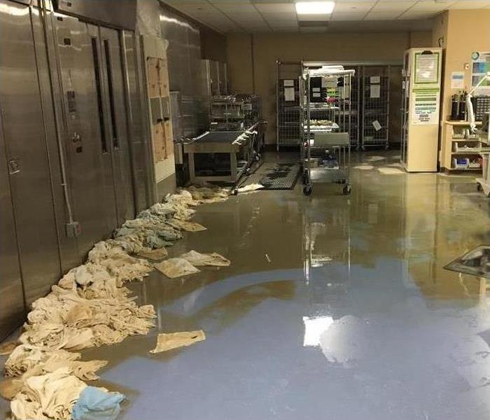 Flooded kitchen, towels soaked